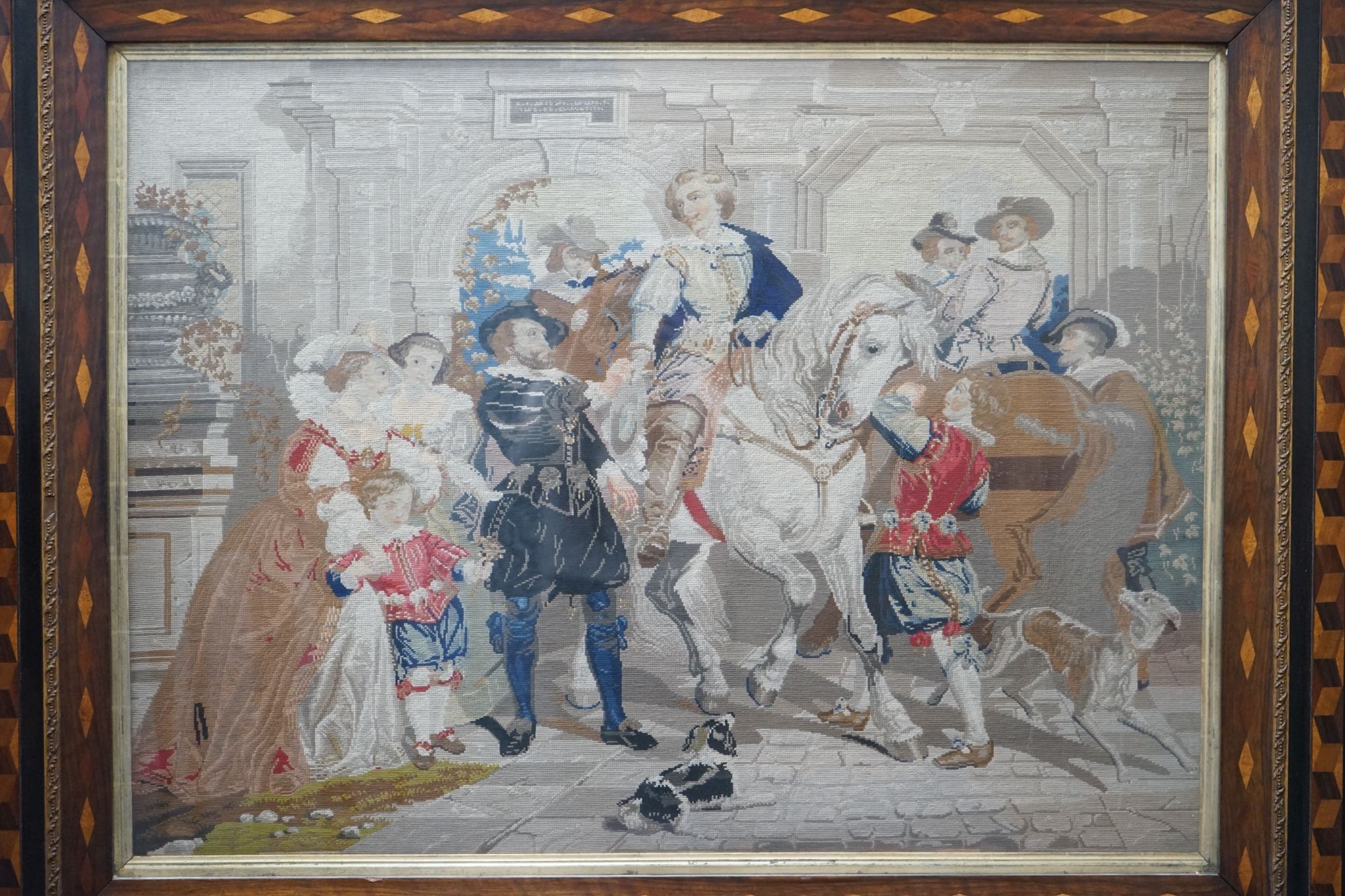 A 19th century Berlin tapestry panel in cubed parquetry and gilt gesso frame, width 146cm, height 120cm